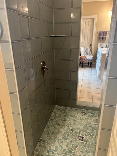 Stone and tile master bath inside view 